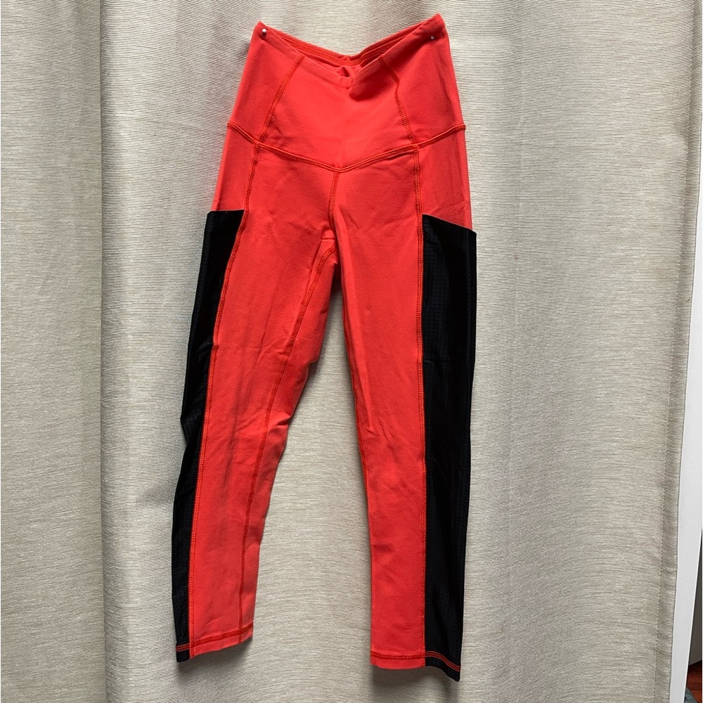 North Face leggings orange and black with pockets